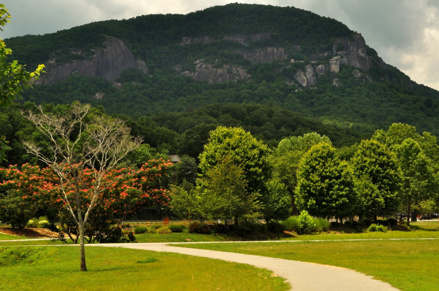 Morse Park June 2025 - a grassy park with landscaping and a large mountain in the background.